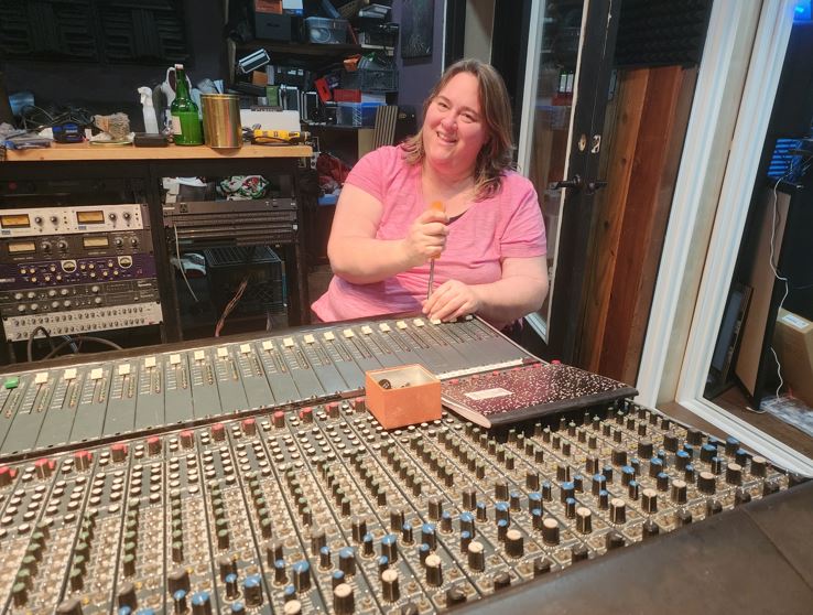 Kathy Jo working on the board at HopeFire Studio